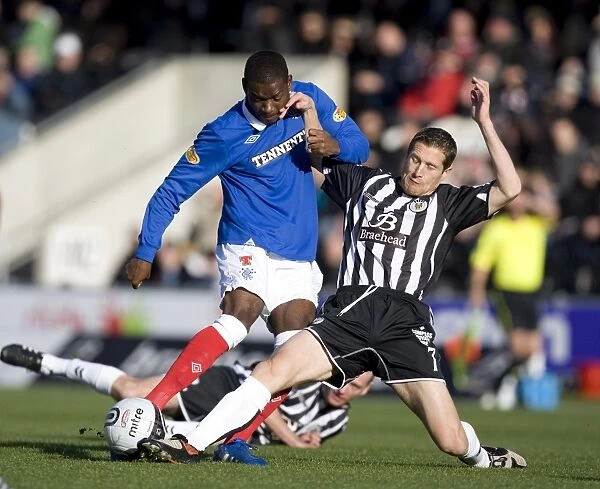 Maurice Edu Tackled by Hugh Murray: A Pivotal Moment in St Mirren vs Rangers (1-3) Clydesdale Bank Scottish Premier League