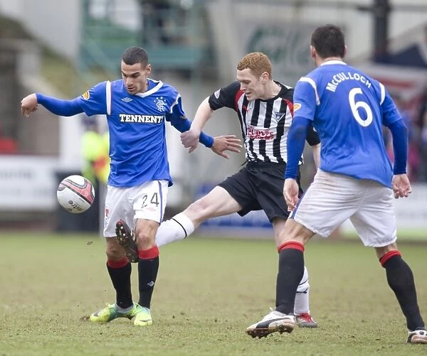 Mervan Celik vs. Ryan Thomson: A Clash in the Clydesdale Bank Scottish Premier League (4-1) - Dunfermline vs. Rangers