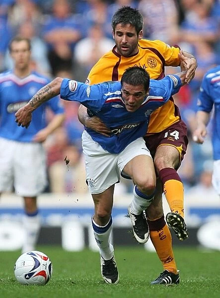 Nacho Novo's Determined Stand: Rangers 1-0 Victory Over Motherwell vs. Keith Lasley