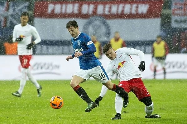 Rangers Andy Halliday Soars Over Marcel Sabitzer in Thrilling RB Leipzig Friendly Clash