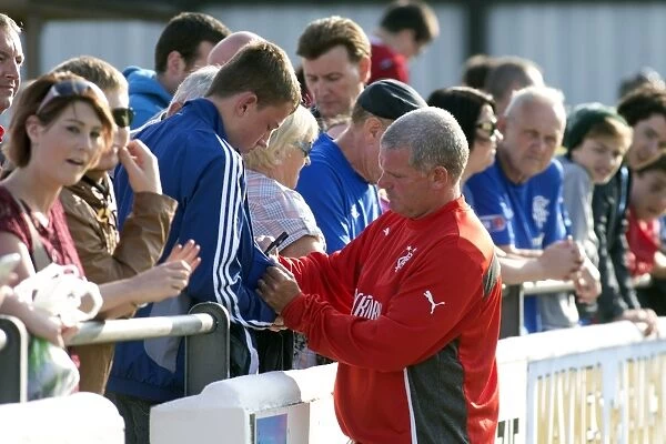Rangers Coach Ian Durrant Signs Fan's Shirt after Pre-Season Win against Elgin City (1-0)