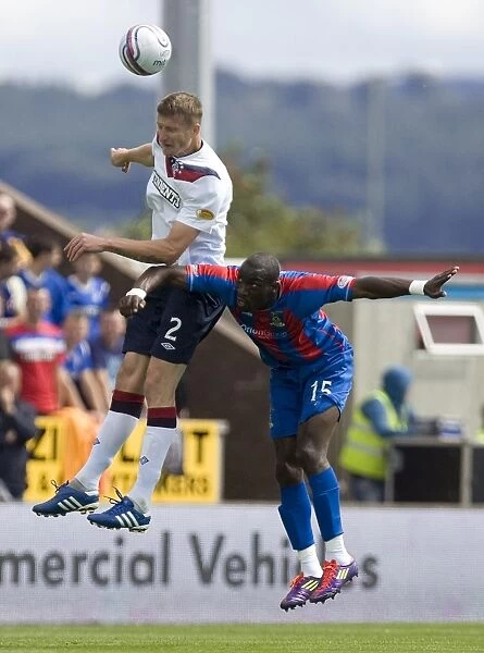 Rangers Dorin Goian and Gregory Tade Clash in CPL: Inverness Caledonian Thistle vs Rangers (2-0)