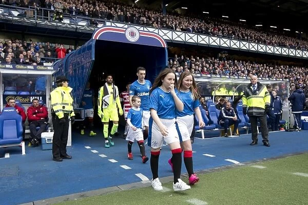 Rangers FC: Lee Wallace Kicks Off Premiership Match at Ibrox Stadium with Mascots
