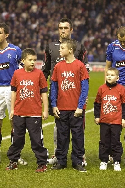 Rangers Football Club: Celebrating a 2-1 Victory Over Hearts with Cash for Kids Mascot at Ibrox