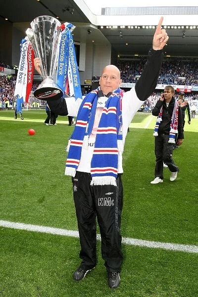 Rangers Football Club: SPL Champions - Kenny McDowall Celebrates with the Trophy at Ibrox Stadium