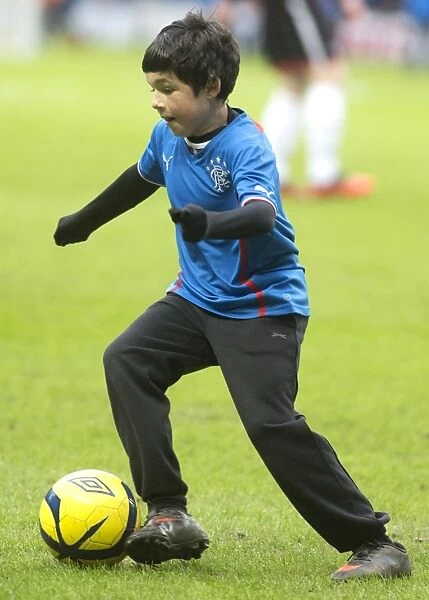 Rangers Football Club: Young Soccer Stars of Ibrox Stadium Dazzle at Half Time during Scottish League One Match against Dunfermline Athletic - 2003 Scottish Cup Champions Prodigies Shine on the Pitch