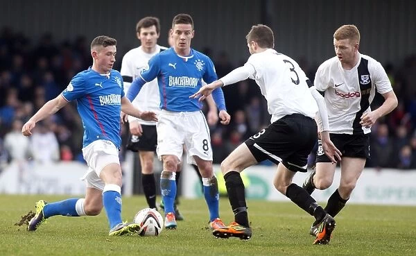 Rangers Fraser Aird Charges Towards Ayr United's Gordon Pope in Intense Scottish League One Clash at Somerset Park