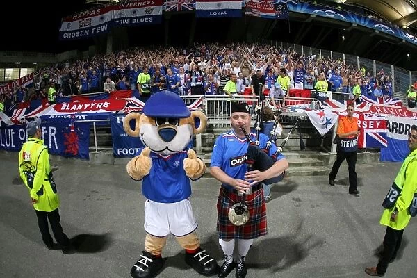 Rangers Glory: Broxi Bear and Jubilant Fans Celebrate 3-0 Victory Over Olympique Lyonnais in UEFA Champions League
