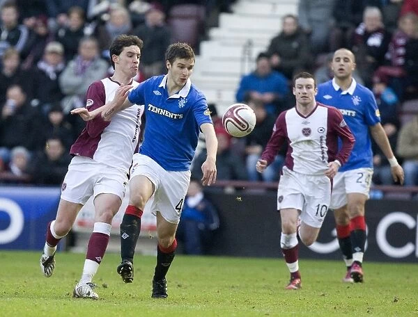 Rangers Jamies Ness Defends Against Hearts Ruben Palazuelos in 1-0 Clydesdale Bank Scottish Premier League Thriller at Tynecastle