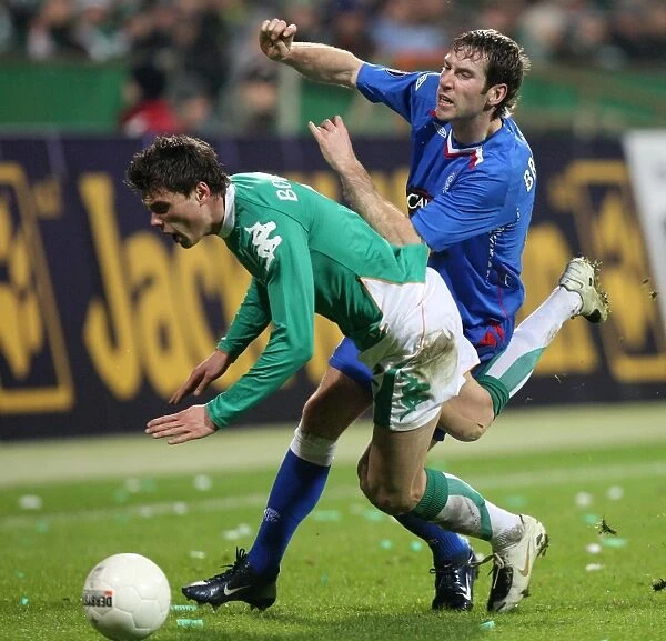 Rangers Kirk Broadfoot Faces Off Against Werder Bremen in UEFA Cup Round of 16 Second Leg: 1-0 Lead for the Germans at Weserstadion