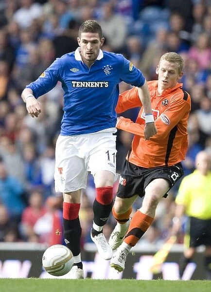 Rangers Kyle Lafferty vs Dundee United's Scott Robertson: A Intense Clash in the Scottish Premier League (4-0)