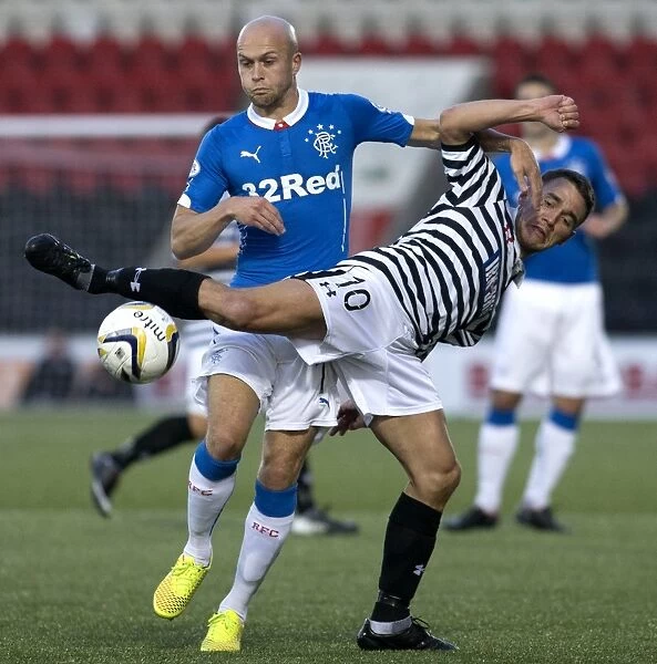Rangers Law and Queens Park's Fraser Clash in Scottish League Cup Match