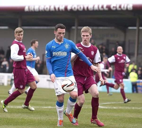 Rangers Nicky Clark Fends Off Arbroath's Colin Hamilton in Scottish League One Clash at Gayfield Park