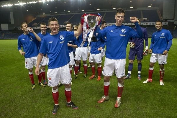 Rangers Reserves: Fraser Aird and Luca Gasparotto Celebrate SFL Reserve League Victory with the Trophy after 2-0 Win over Queens Park Reserves