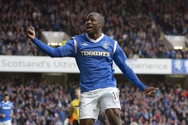 Rangers Sone Aluko: Celebrating His First Goal in the 5-0 Thrashing of Dundee United at Ibrox Stadium (Scottish Premier League)