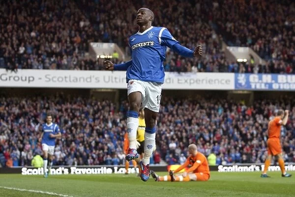 Rangers Sone Aluko Rejoices in His First Goal: 5-0 Victory Over Dundee United at Ibrox Stadium (Scottish Premier League)