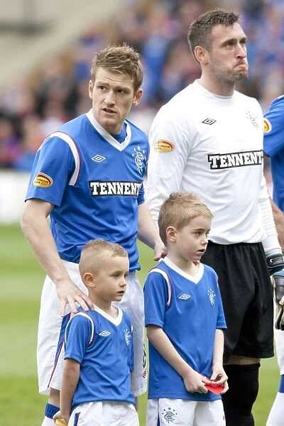 Rangers Steven Davis Celebrates Glory with Mascots after Securing Motherwell's 1-2 Defeat in Scottish Premier League