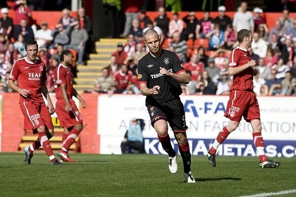 Rangers Thrilling Comeback: Kenny Miller's Dramatic Penalty (3-2) at Pittodrie Stadium - Clydesdale Bank Premier League