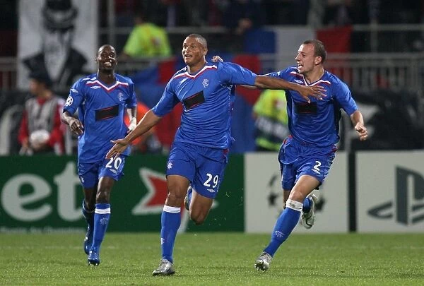 Rangers Triumph: Beasley, Hutton, and Cousin Celebrate Historic 3-0 Victory over Olympique Lyonnais in UEFA Champions League