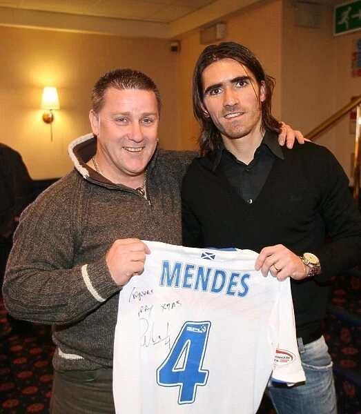 A Special Moment: Pedro Mendes Honors a Rangers FC Fan with a Prize at the Charity Race Night (2008)