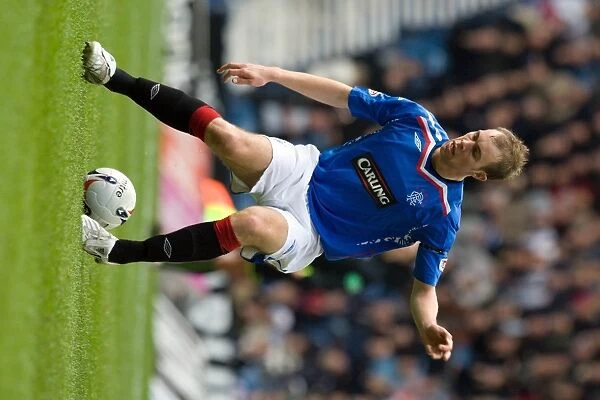Steven Whittaker Scores the Opener: Rangers 2-0 Falkirk in Scottish Premier League Action at Ibrox