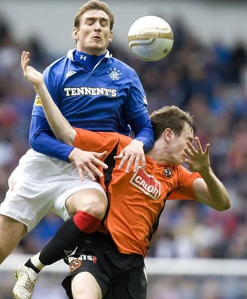 Thrilling Comeback: Jelavic and Douglas Star in 2-3 Victory for Dundee United at Ibrox Stadium