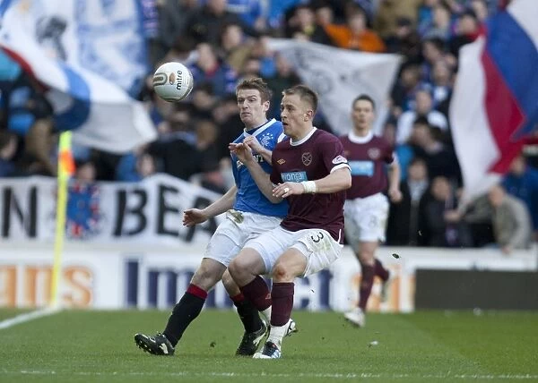 Thrilling Scottish Premier League Clash: Stevenson Scores the Winner for Hearts over Davis and Grainger's Rangers (1-2)
