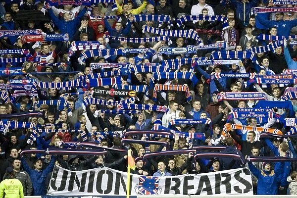 Triumphant Rangers Fans Celebrate in Scarfs: A Glorious 3-0 Victory at Ibrox Stadium