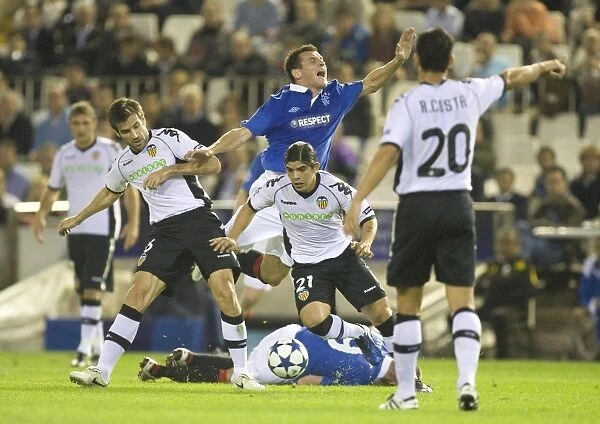 Valencia's Edge: Controversial Foul on Lee McCulloch Marred Group C Clash (3-0)
