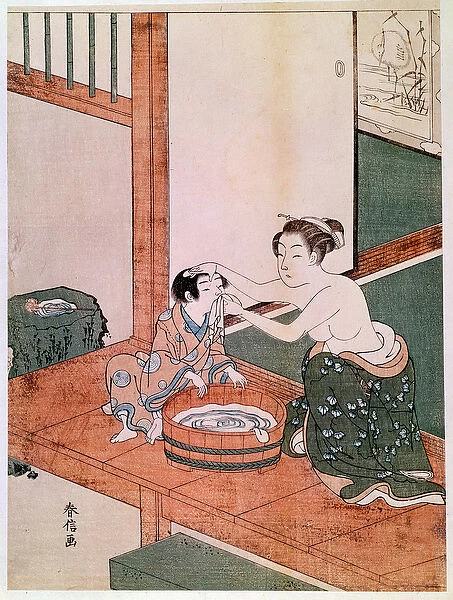 A naked mother washing her child in Japan near a basin filled with water