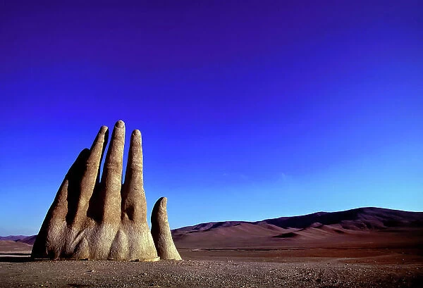 Giant hand sculpture (Mano De Desierto) rises from the sands of the Atacama Desert, Chile