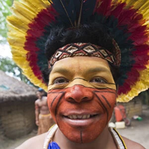 Brazil, Bahia, Porto Seguro, Pataxo indigenous man wearing a feather headdress in