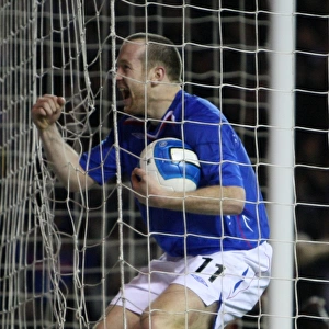 European Nights at Ibrox: Rangers Double Delight - Charlie Adam and Steven Davis Score Against Werder Bremen in the UEFA Cup (Round of 16, First Leg)