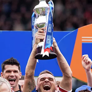 Rangers Football Club: Lee McCulloch's Triumphant Promotion Celebration with the Irn Bru Trophy at Ibrox Stadium