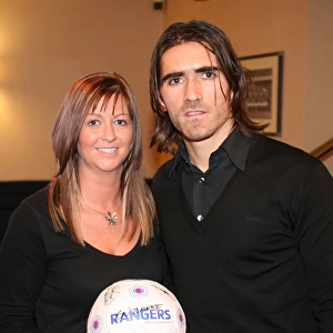 Rangers Football Club's Pedro Mendes Celebrates with Charity Race Night Winner (2008)