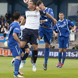 Thrilling Third Division Showdown: Lee McCulloch's Header Amidst Intense Action at Balmoor Park (2-2)