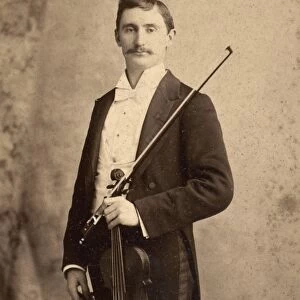 VIOLINIST, c1900. Charles d Almaine (1871-1943), noted solo violinist