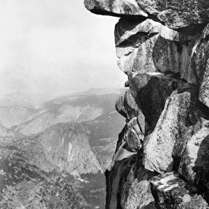 YOSEMITE: GLACIER POINT. William Henry Jackson photographing from a rock ledge