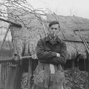 Antoon van den Hurk Mathematician Standing in front of thatched property with