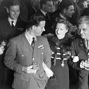 Dam Busters. Wing Commander Guy Gibson and Mrs Gibson talking with Captain W. K Clark, U