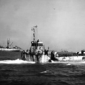 Landing craft loaded with troops head towards the Normandy beaches during D Day invasion