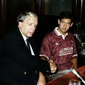 New signing Graeme Hogg with Hearts Manager Wallace Mercer at Tynecastle in Edinburgh