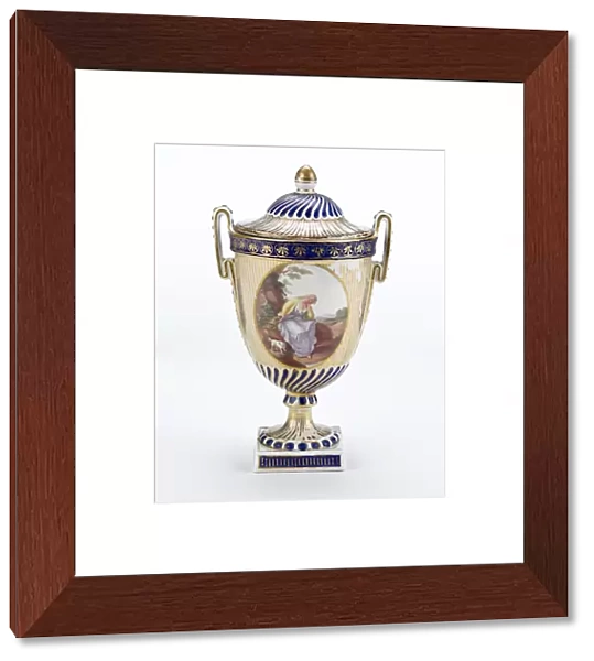 Urn made from porcelain with a white ground, painted in gold