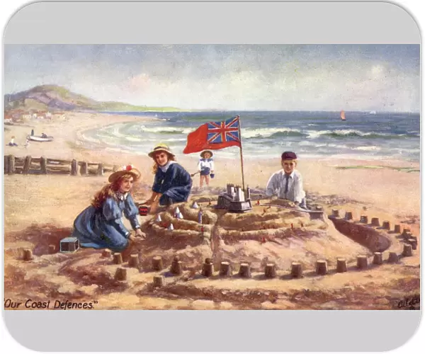 Children build a fantastic sandcastle on summer beach holiday