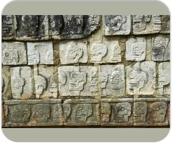 Detail of stone relief of skulls, ancient Mayan ruins, Chichten Itza, UNESCO World Heritage Site