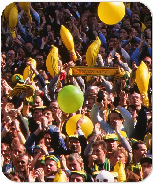 Norwich City fans cheer on their team with balloons and canary inflatables during the 1989 FA Cup