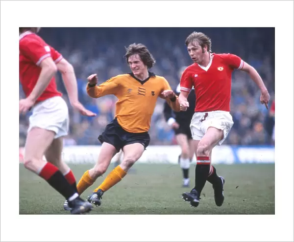 Manchester Uniteds Brian Greenhoff and Wolves Mel Eves