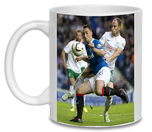 Rangers vs Hibernian: A Fight for the Petrofac Training Cup - Ibrox Stadium: Wallace vs Gray's Intense Battle for Possession (Scottish Cup, 2003)