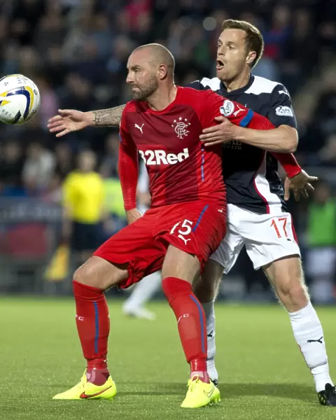 Clash on the Pitch: Rangers Kris Boyd vs Falkirk's Alan Maybury - A Battle for Supremacy in the SPFL Championship