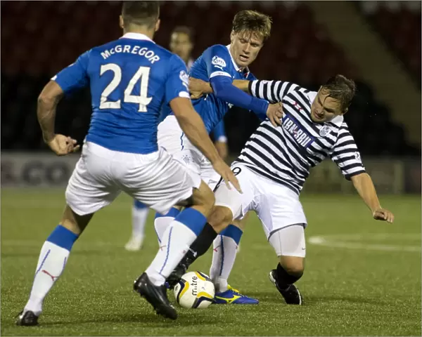 Intense Clash: Marius Zaliukas vs Ross McPherson - Rangers Holds Off Queens Park in Scottish League Cup